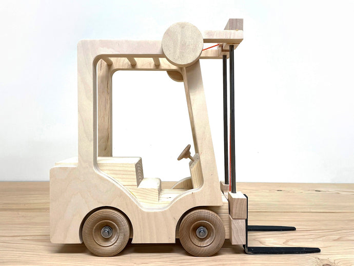 Toy Forklift, Industrial Quality, made from wood and steel, and lifetime durable components.This is a real toy; engaging, realistic, with a simple mechanical device to raise and lower the forks. It is designed with 