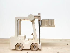 Toy Forklift, Industrial Quality, made from wood and steel, and lifetime durable components.This is a real toy; engaging, realistic, with a simple mechanical device to raise and lower the forks. It is designed with "unbreakable" as a key feature